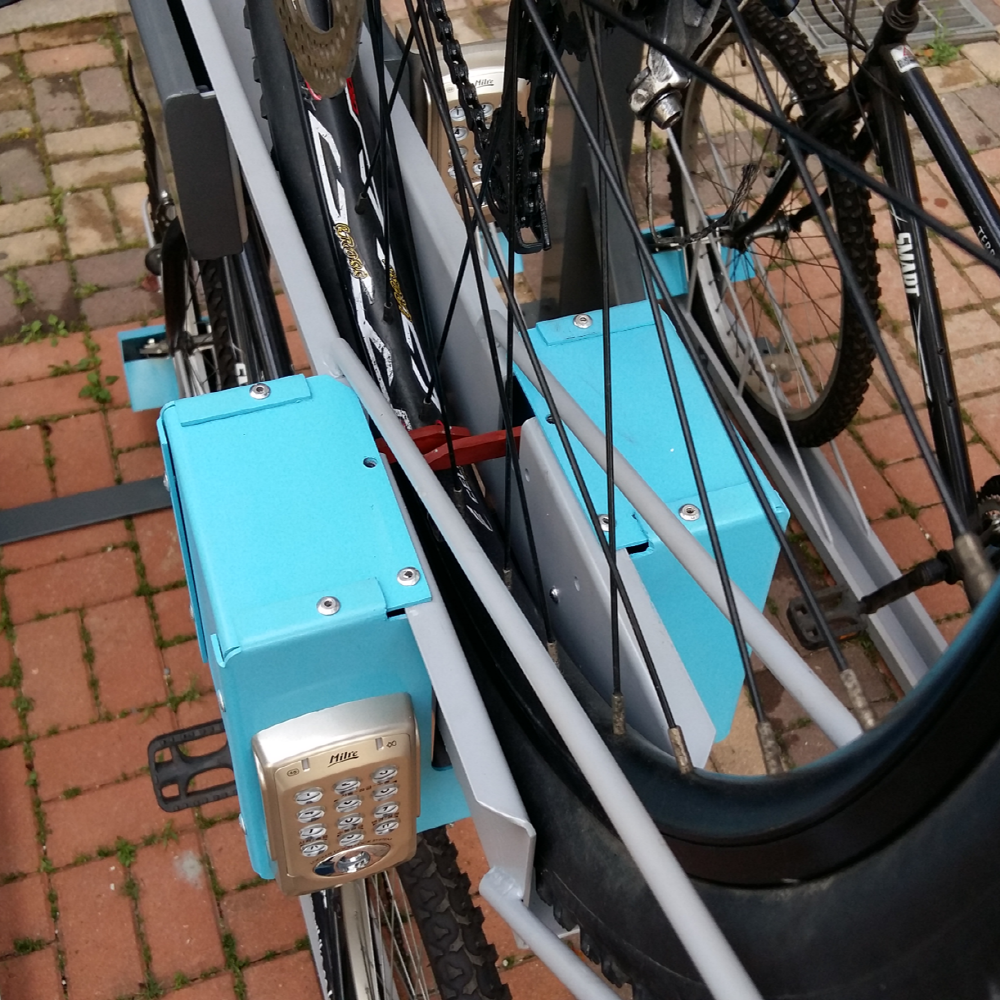 Bicycle storage rack and locking device to prevent loss/theft of bicycle